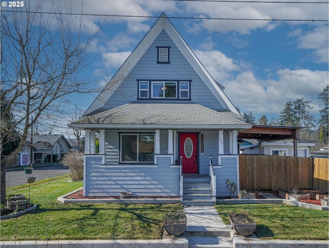 view of front facade with covered porch and a front lawn