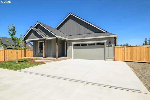88109 Jameson Way, Veneta, OR 97487 - view of front of property with board and batten siding, a garage, a shingled roof, driveway, and a porch