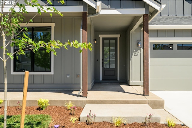 88109 Jameson Way, Veneta, OR 97487 - view of exterior entry featuring board and batten siding, roof with shingles, a porch, and a garage