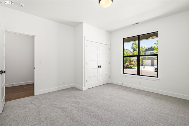 88109 Jameson Way, Veneta, OR 97487 - unfurnished bedroom with carpet, baseboards, and a closet