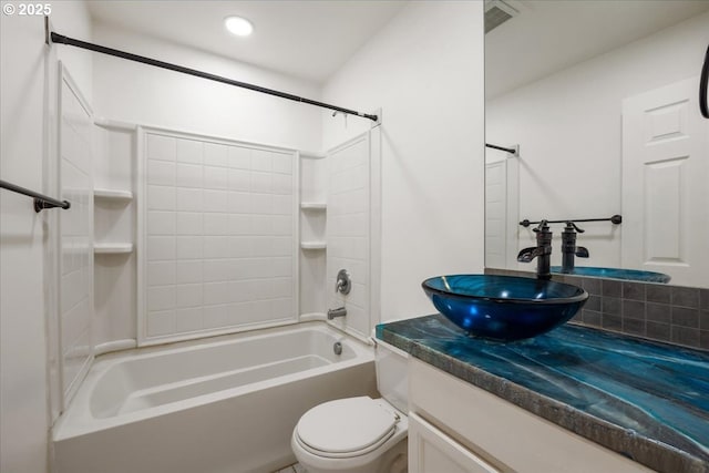 bathroom featuring toilet, shower / bathing tub combination, backsplash, and vanity