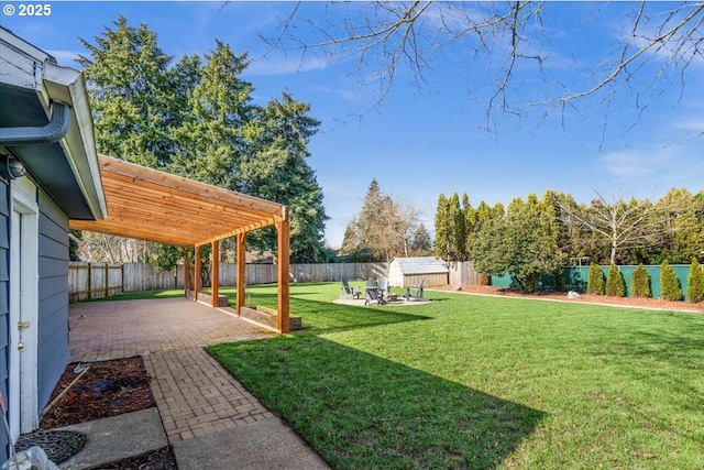 view of yard featuring a fenced backyard, a pergola, and a patio