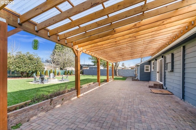 view of patio with an outdoor fire pit, a fenced backyard, and a pergola