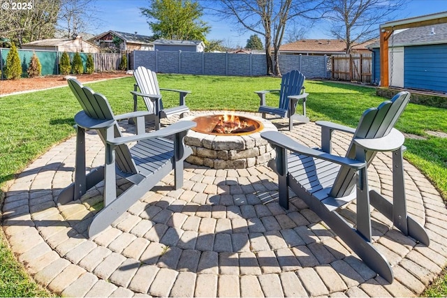 view of patio with a fire pit and a fenced backyard