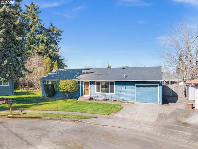 single story home featuring entry steps, concrete driveway, an attached garage, fence, and a front yard