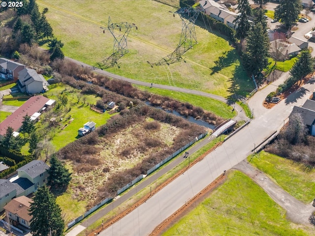 birds eye view of property with a residential view