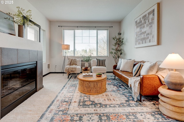 695 NW Falling Waters Ln Unit 304, Portland, OR 97229 - living area with carpet, a fireplace, and baseboards