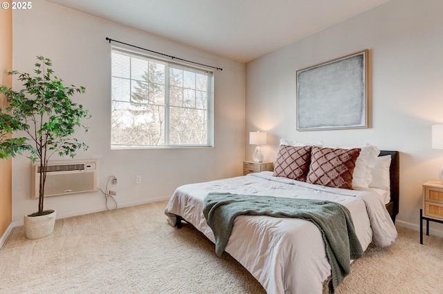 695 NW Falling Waters Ln Unit 304, Portland, OR 97229 - bedroom with carpet flooring, a wall unit AC, and baseboards