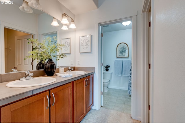 695 NW Falling Waters Ln Unit 304, Portland, OR 97229 - full bath with toilet, double vanity, and tile patterned floors