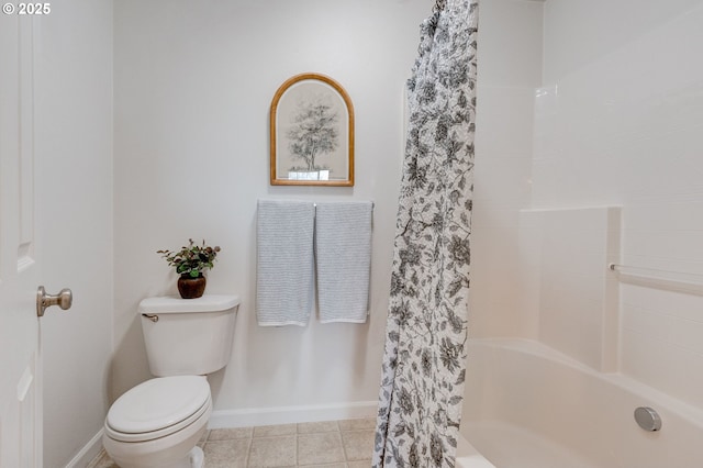 695 NW Falling Waters Ln Unit 304, Portland, OR 97229 - full bath with toilet, baseboards, and tile patterned floors