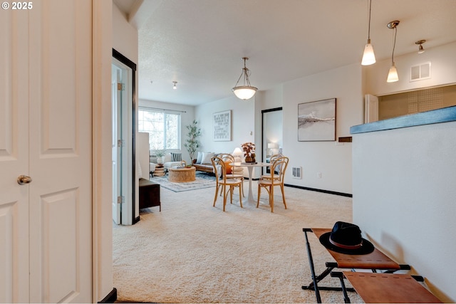 695 NW Falling Waters Ln Unit 304, Portland, OR 97229 - carpeted dining space featuring baseboards