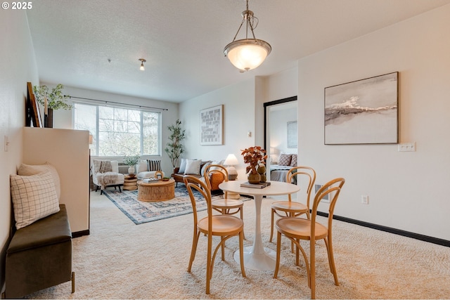 695 NW Falling Waters Ln Unit 304, Portland, OR 97229 - dining area with light colored carpet and baseboards