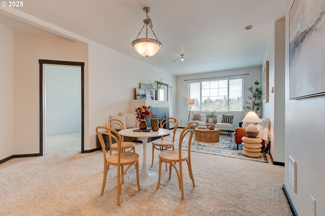 695 NW Falling Waters Ln Unit 304, Portland, OR 97229 - dining area with light colored carpet and baseboards