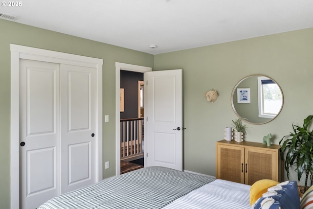 bedroom featuring a closet and visible vents