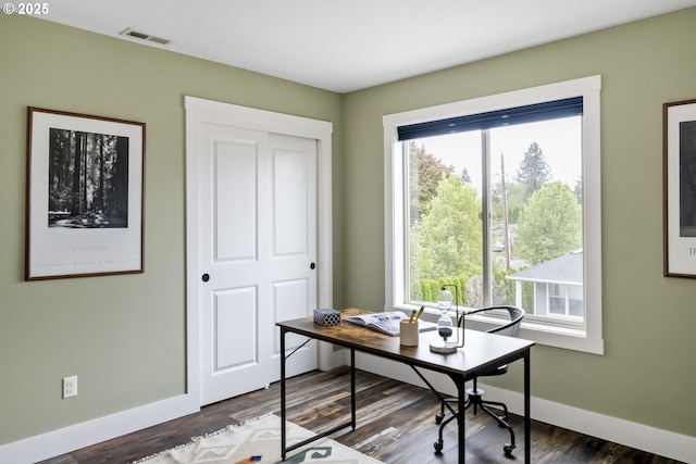 office area featuring baseboards, wood finished floors, and visible vents