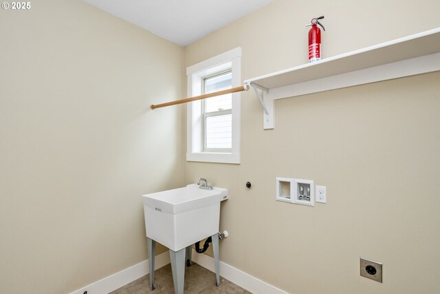 laundry room with gas dryer hookup, laundry area, electric dryer hookup, baseboards, and hookup for a washing machine
