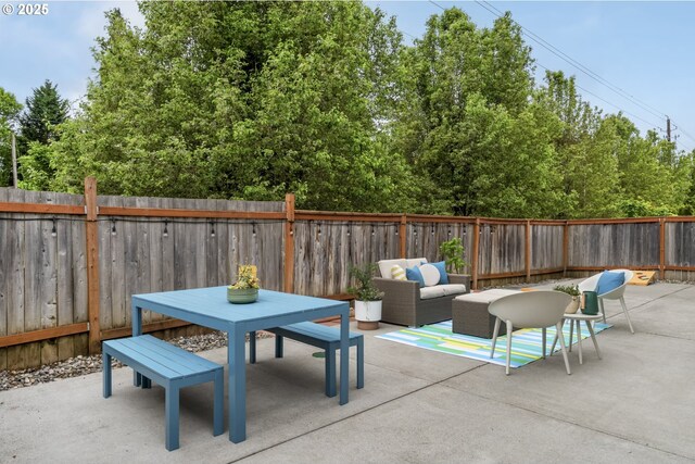 view of patio / terrace with outdoor dining area and a fenced backyard