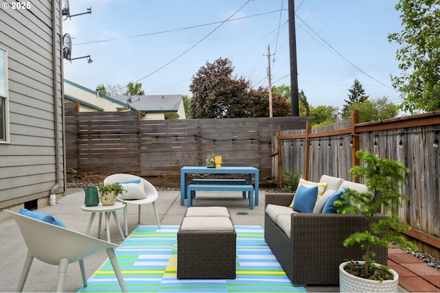 view of patio / terrace with a fenced backyard and an outdoor living space