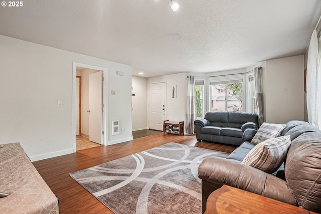 2812 NE Delancey Ct, Vancouver, WA 98682 - living room featuring wood finished floors and a textured ceiling