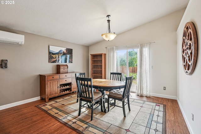 2812 NE Delancey Ct, Vancouver, WA 98682 - dining space with an AC wall unit, light wood finished floors, and lofted ceiling