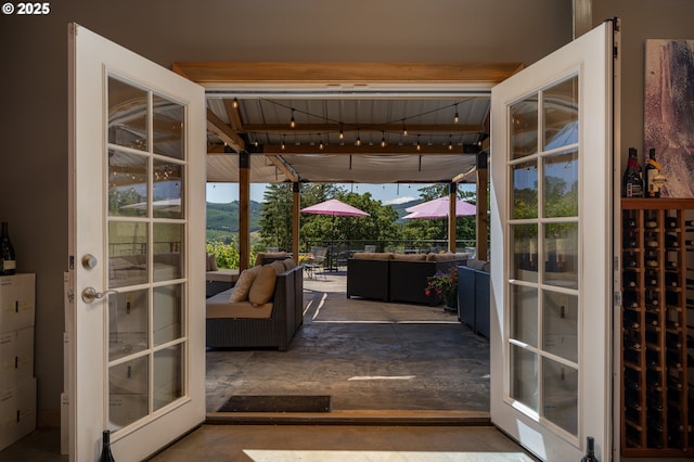 entryway featuring concrete flooring and a mountain view