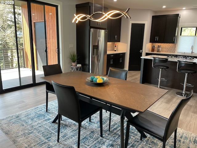 113 NW Willard St, Stevenson, WA 98648 - dining room with light wood finished floors, a chandelier, and recessed lighting