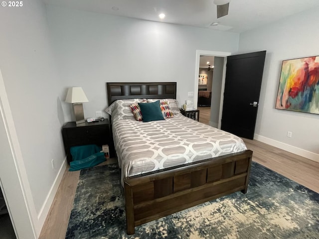 113 NW Willard St, Stevenson, WA 98648 - bedroom with wood finished floors, baseboards, recessed lighting, and ceiling fan