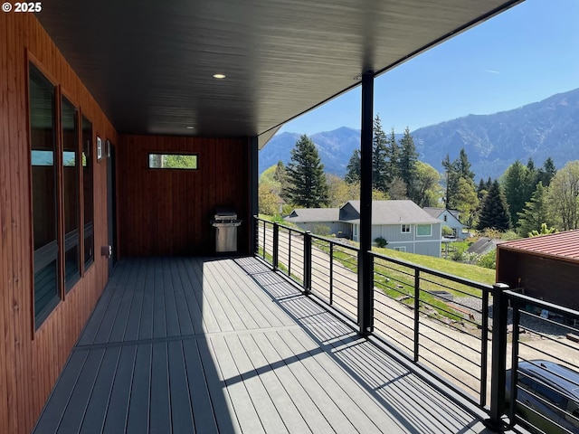 wooden deck with a mountain view