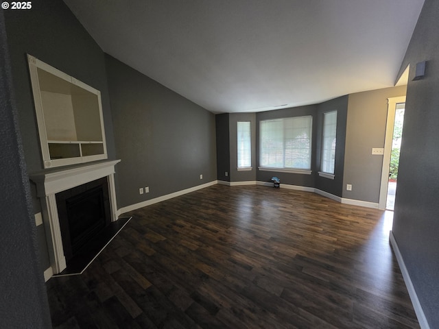 15503 NE 84th St, Vancouver, WA 98682 - unfurnished living room featuring lofted ceiling, dark wood-style flooring, a fireplace, and baseboards