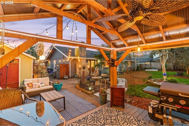 view of patio / terrace featuring an outdoor living space, a ceiling fan, a gazebo, an outdoor structure, and fence