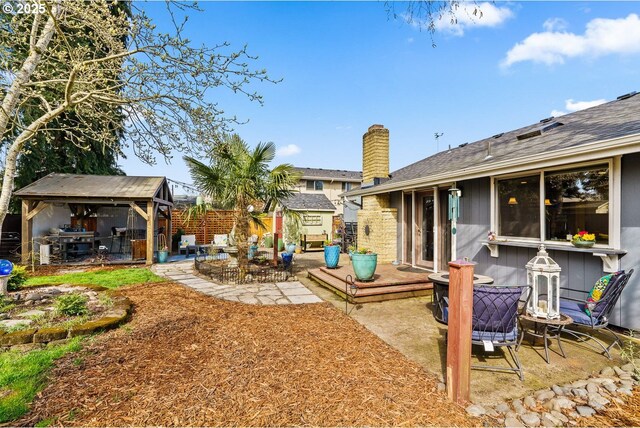 view of yard with an outbuilding and a patio