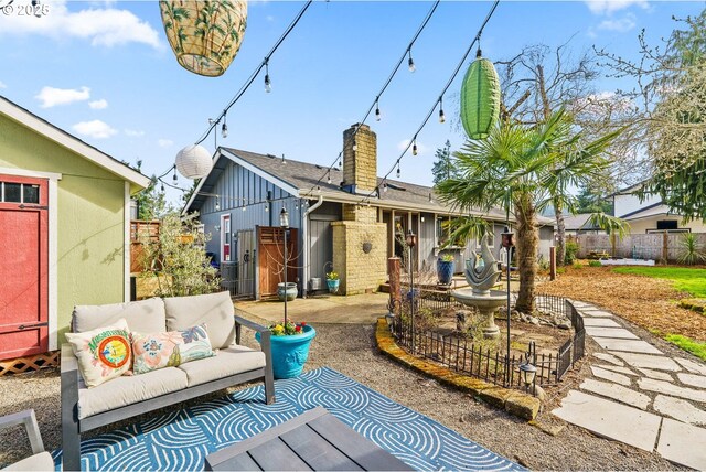 view of patio / terrace featuring an outdoor living space and fence