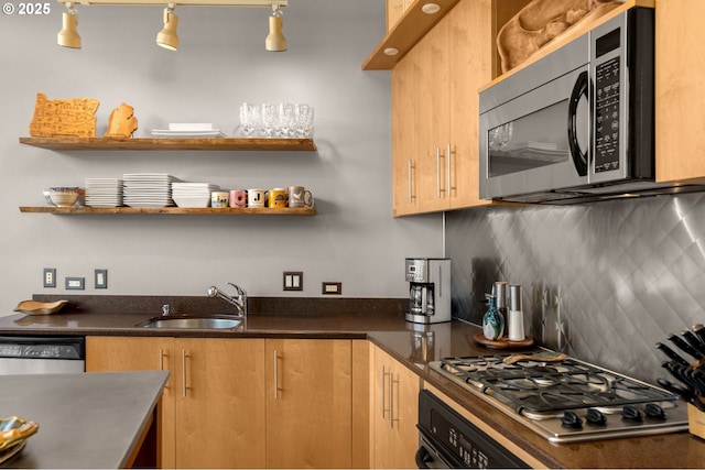 kitchen with tasteful backsplash, dark countertops, stainless steel appliances, open shelves, and a sink