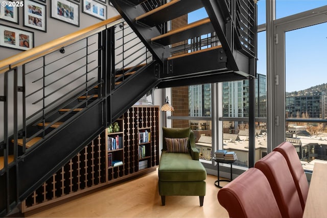 interior space with expansive windows and wood finished floors