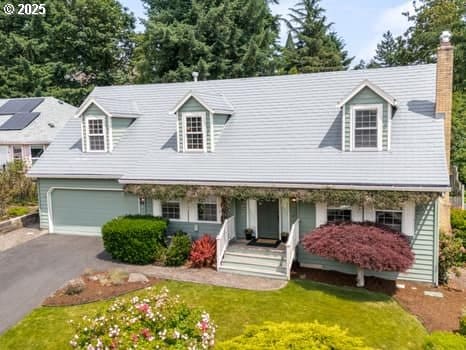 2487 Southslope Way W, Linn, OR 97068 - cape cod house featuring a porch, driveway, a chimney, and a front lawn
