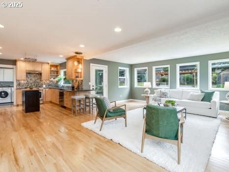2487 Southslope Way W, Linn, OR 97068 - living room with recessed lighting, light wood-style floors, and washer / clothes dryer