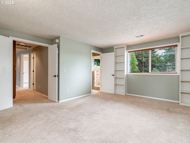 2487 Southslope Way W, Linn, OR 97068 - unfurnished bedroom with carpet flooring, a textured ceiling, and baseboards