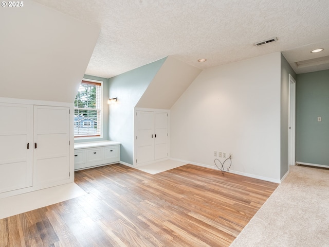 2487 Southslope Way W, Linn, OR 97068 - additional living space featuring light wood finished floors, a textured ceiling, baseboards, recessed lighting, and lofted ceiling