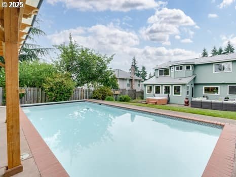 2487 Southslope Way W, Linn, OR 97068 - view of swimming pool with outdoor lounge area, a fenced backyard, and a residential view