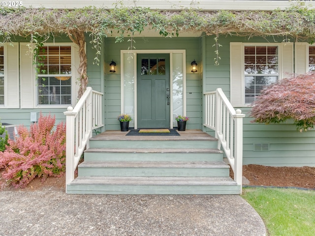 2487 Southslope Way W, Linn, OR 97068 - entrance to property with a porch and central air condition unit