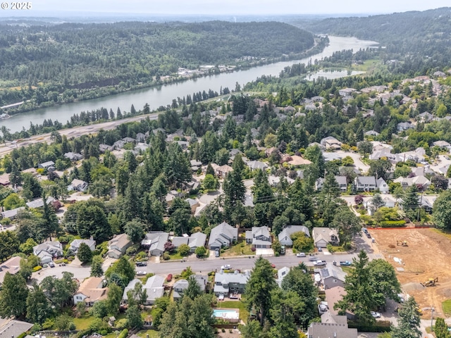 2487 Southslope Way W, Linn, OR 97068 - aerial perspective of suburban area with a heavily wooded area and a nearby body of water