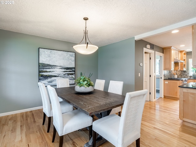 2487 Southslope Way W, Linn, OR 97068 - dining space with light wood-type flooring, baseboards, a textured ceiling, and recessed lighting