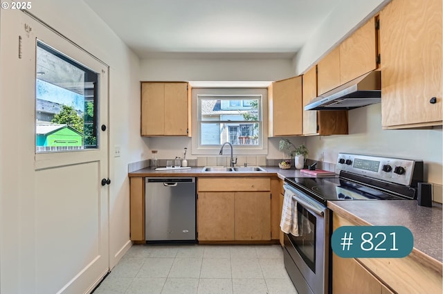 815/821 NE Holman St, Portland, OR 97211 - kitchen with stainless steel appliances, extractor fan, and dark countertops