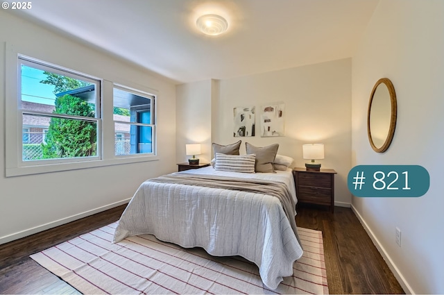 815/821 NE Holman St, Portland, OR 97211 - bedroom featuring wood finished floors and baseboards