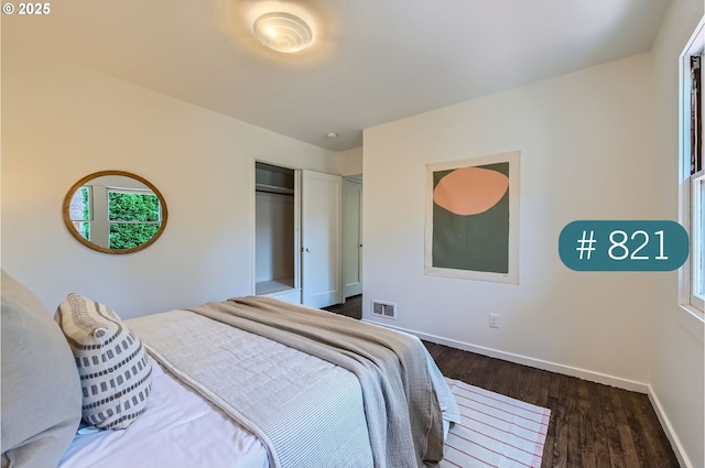 815/821 NE Holman St, Portland, OR 97211 - bedroom featuring wood finished floors, a closet, and multiple windows