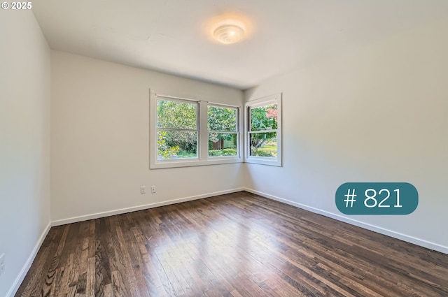815/821 NE Holman St, Portland, OR 97211 - unfurnished room with hardwood / wood-style floors and baseboards