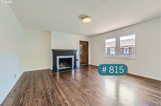 815/821 NE Holman St, Portland, OR 97211 - unfurnished living room with a fireplace with flush hearth and dark wood finished floors
