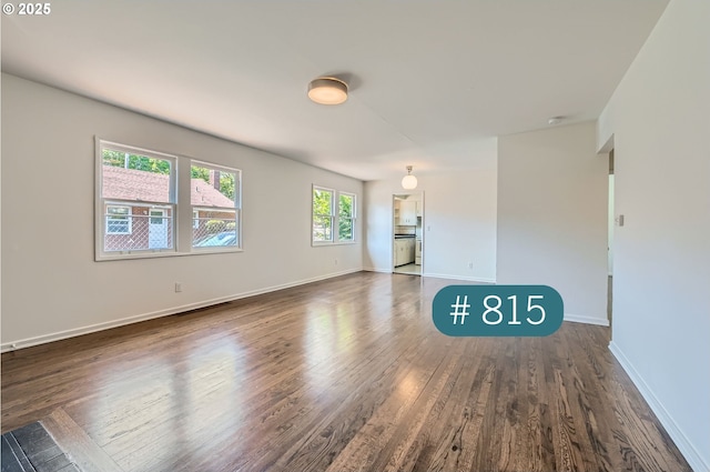 815/821 NE Holman St, Portland, OR 97211 - empty room featuring wood finished floors and a smoke detector