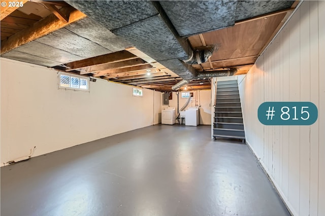 815/821 NE Holman St, Portland, OR 97211 - basement featuring stairway and washing machine and clothes dryer