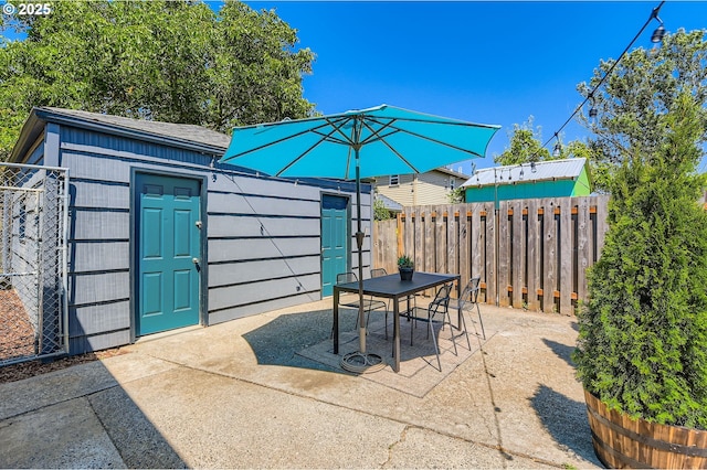815/821 NE Holman St, Portland, OR 97211 - view of patio featuring outdoor dining space and an outdoor structure